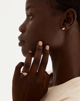 A model wears an oval rutilated quartz trio ring