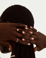 A model wears a classic eternity band of white diamonds