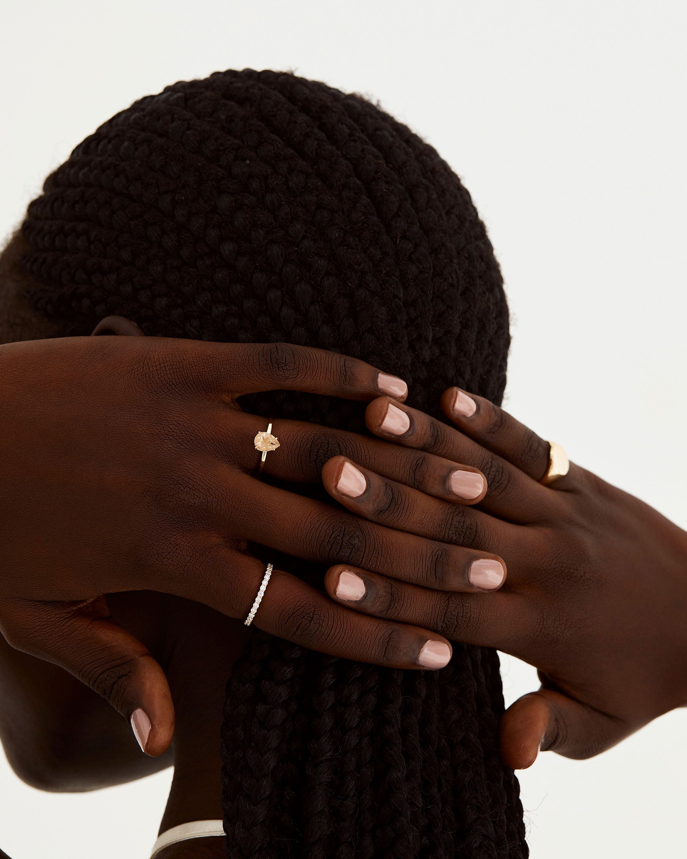 A model wears a half eternity band of white diamonds