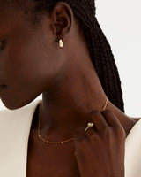 A model wears our petite ellipse hoops