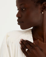 A model wears our Una Rutilated Quartz Studs