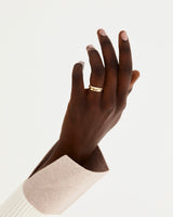 Model wears our 2mm millgrain wedding ring with our knife edge diamond cascade band