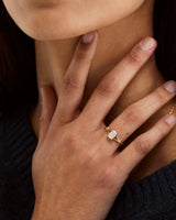 A woman's hand showcasing the Alida | Split Band Solitaire | Diamond | Yellow Gold.