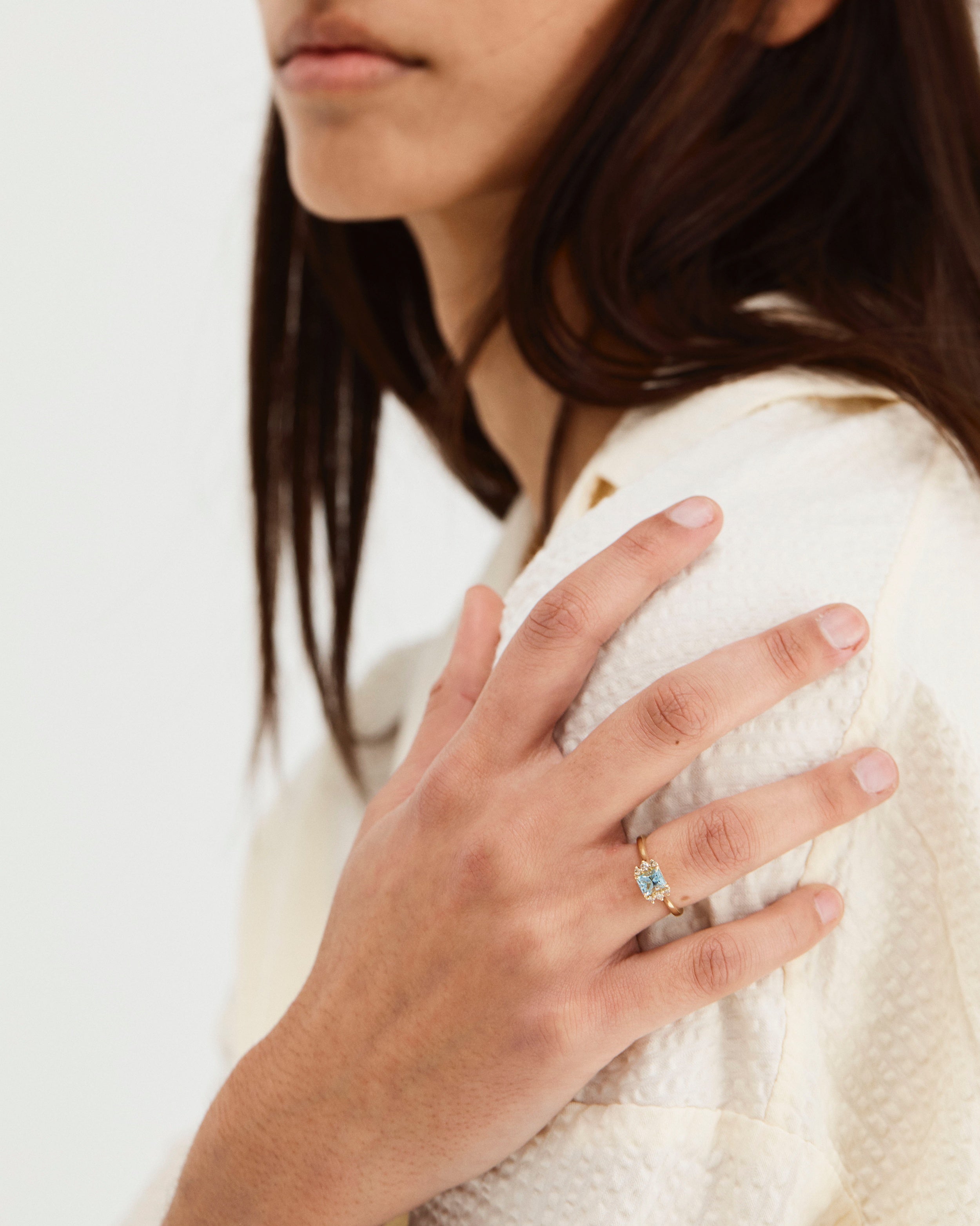 A woman wearing the Mira Ring | Aquamarine.