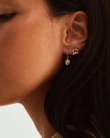 An ear stack featuring the Astral Studs | Diamonds and the Aeris Earrings | Diamond, both in yellow gold.