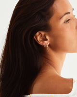 A woman wearing the Aiyana Earrings in Yellow Gold