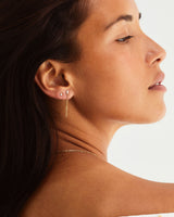Close up of model wearing the Aiona Loop Studs and Aiona Diamond Studs