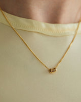 Aether Necklace in Yellow Gold with a multiple charms