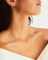 A woman wearing the Cascade Knife Edge Necklace | Diamonds in yellow gold.