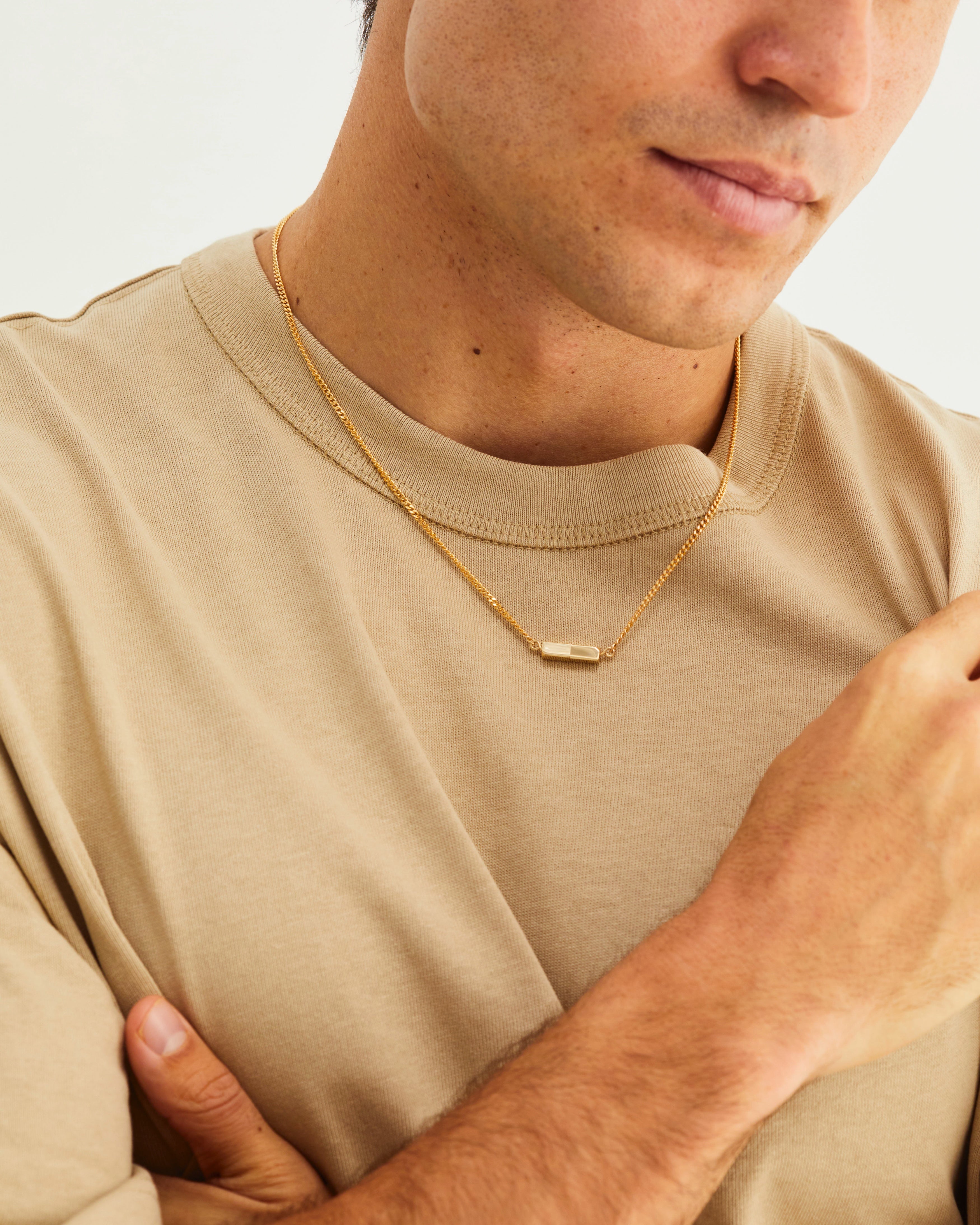 A man wearing the Guardian Chain in yellow gold.