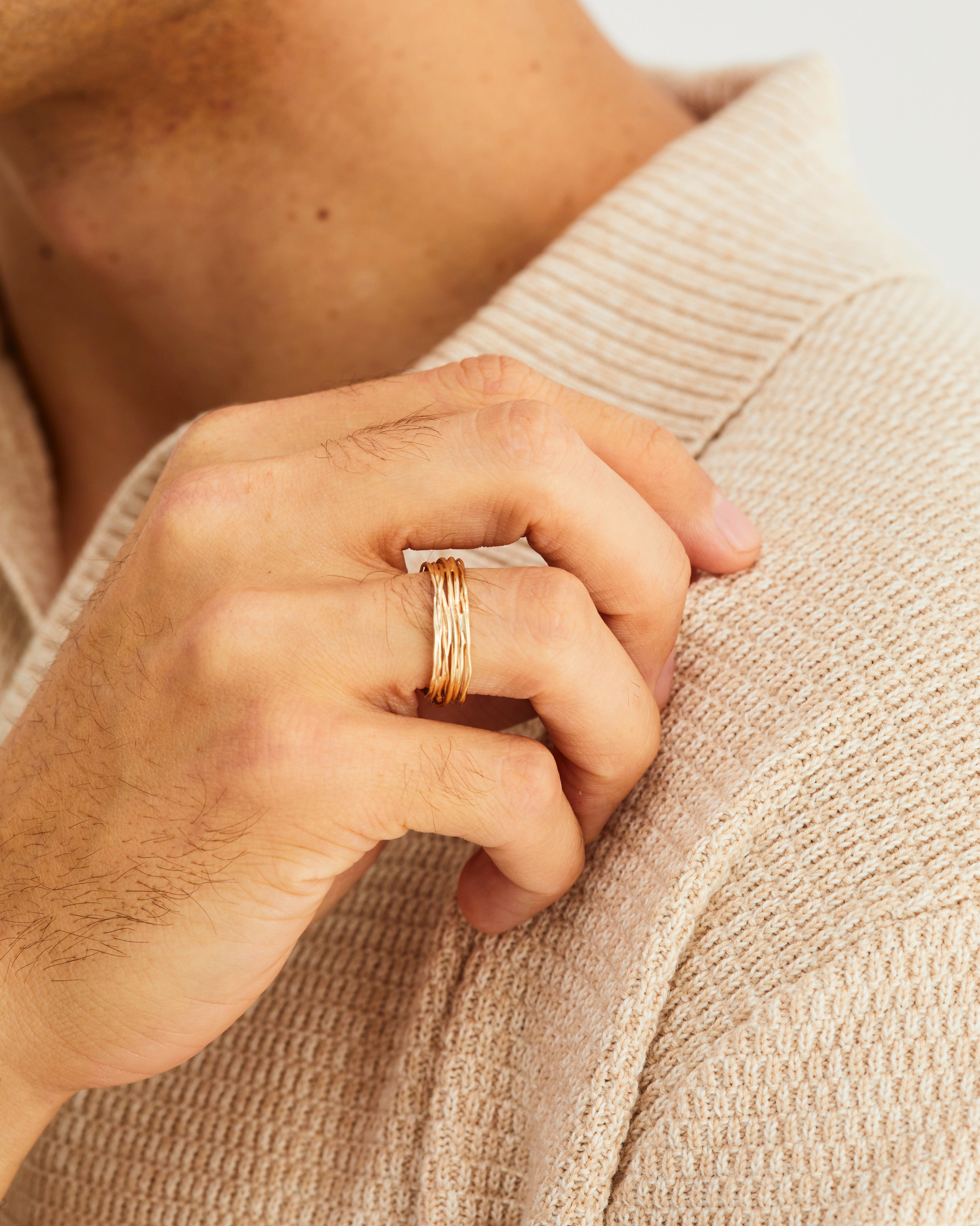 A man wears a Kamali Ring in Yellow Gold