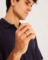 A man wears the Organic Wedding Ring in Yellow Gold