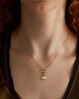 A woman wearing the Terra Necklace | Diamond in yellow gold.