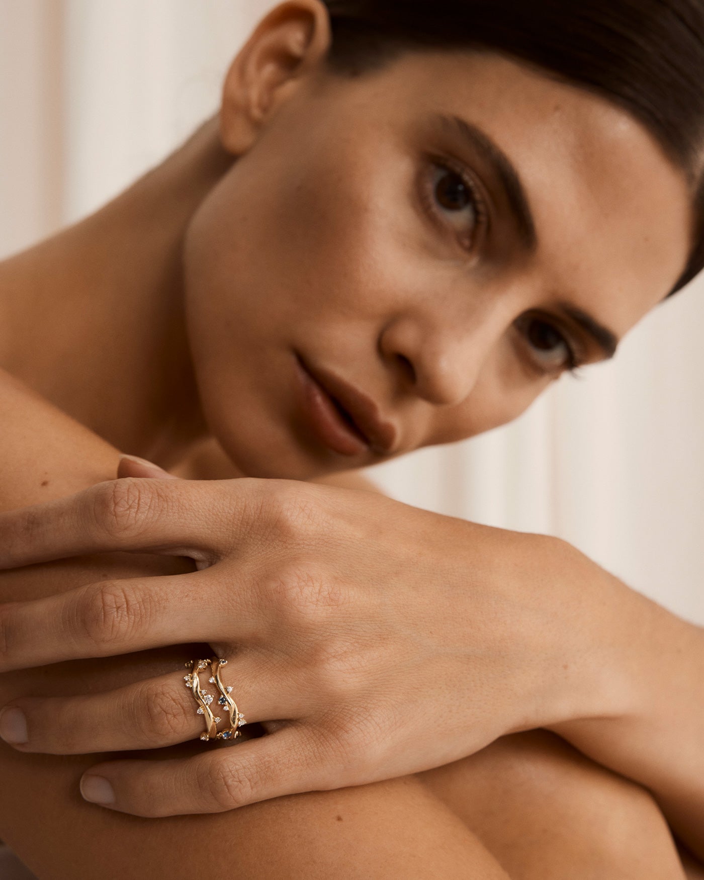 Model image of a lady with dark brown hair wearing the yellow gold ember ring.