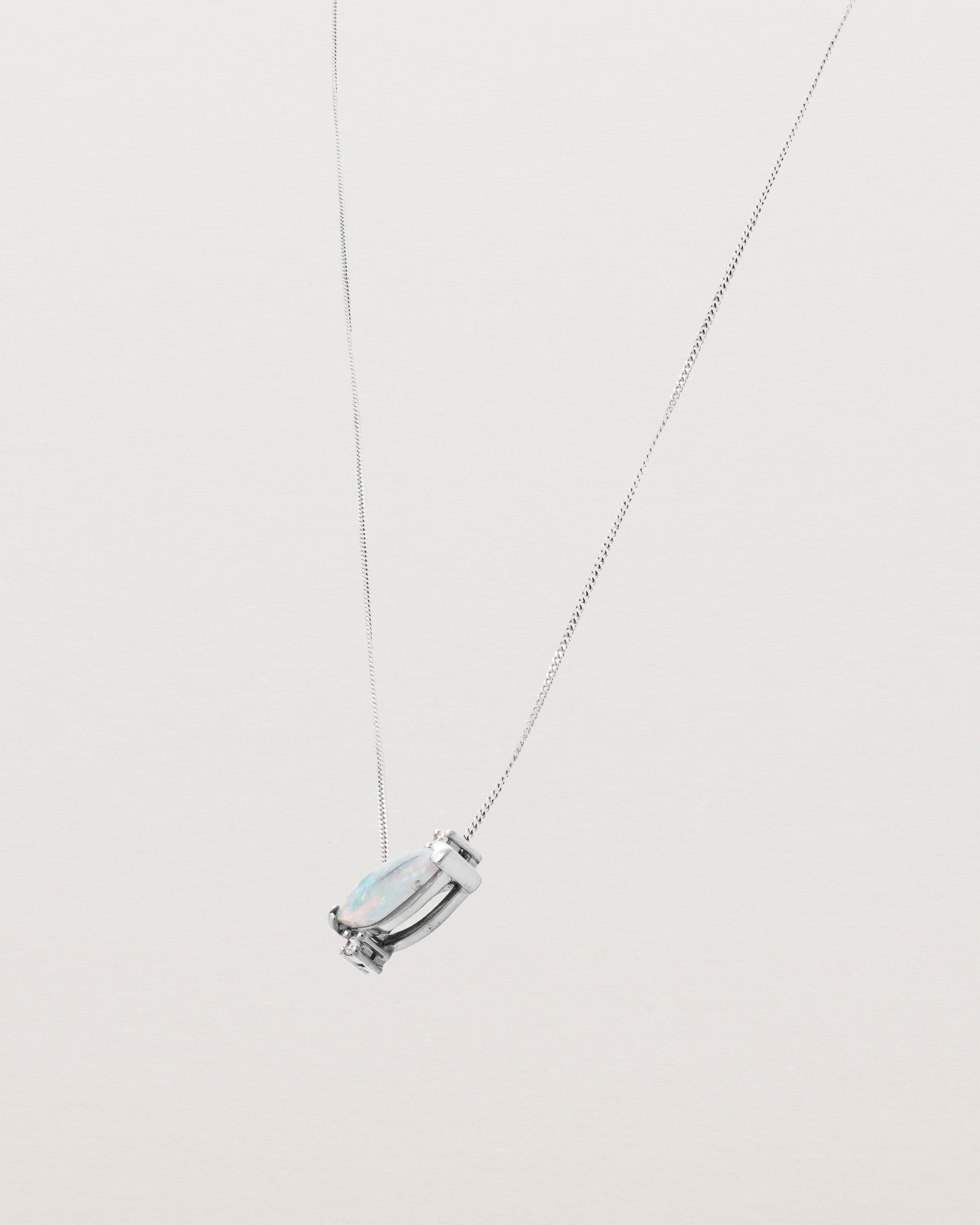 White Gold blue opal necklace with two small white diamonds