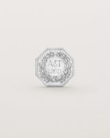 Sterling silver six pence coin engraved with a crest and initials