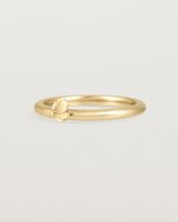Angled view of the Aeris Stacking Ring in yellow gold.