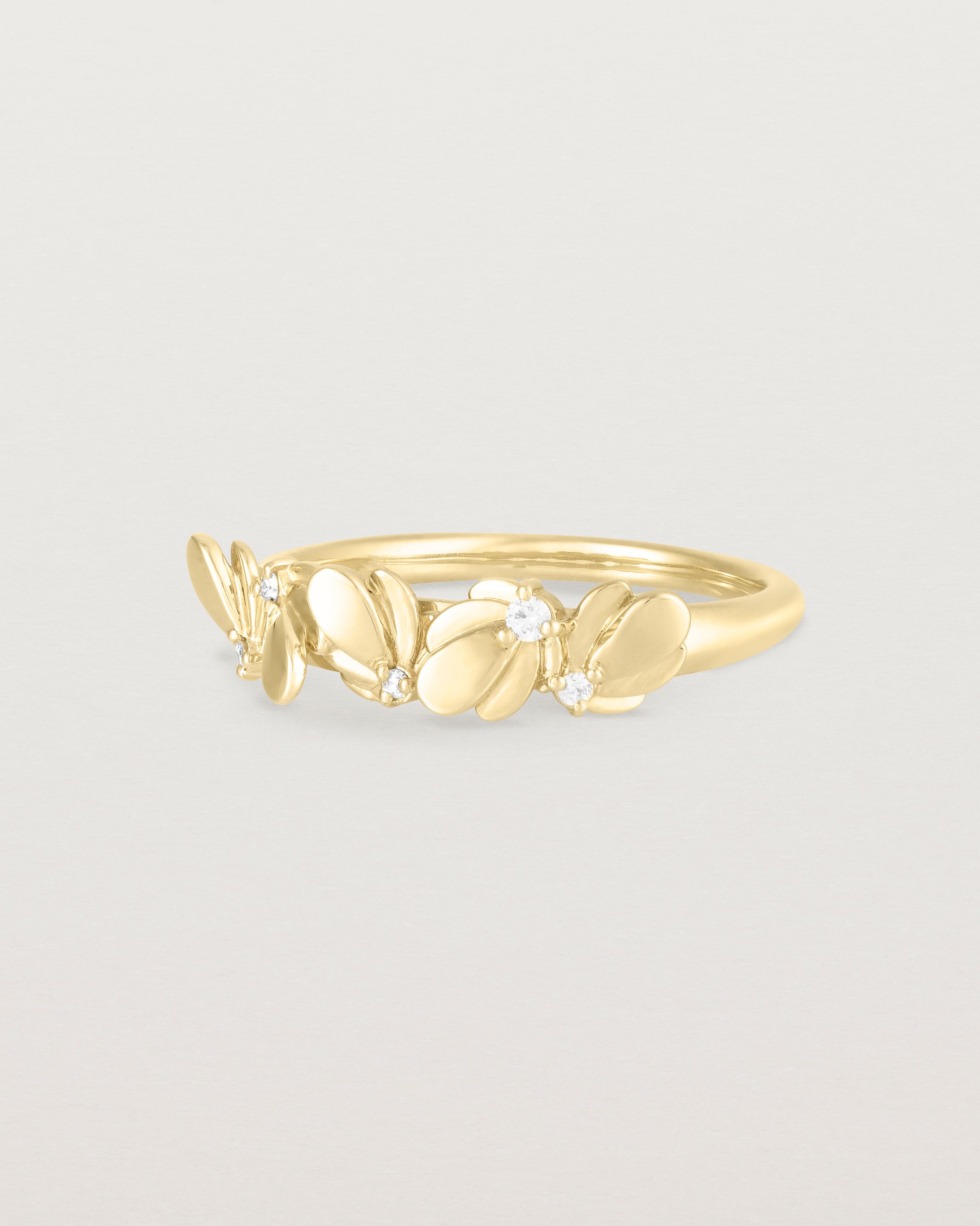 Angled view of the Aeris Wrap Ring | Diamonds in Yellow Gold.