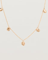 Close up view of the Aeris Charm Necklace in Rose Gold.