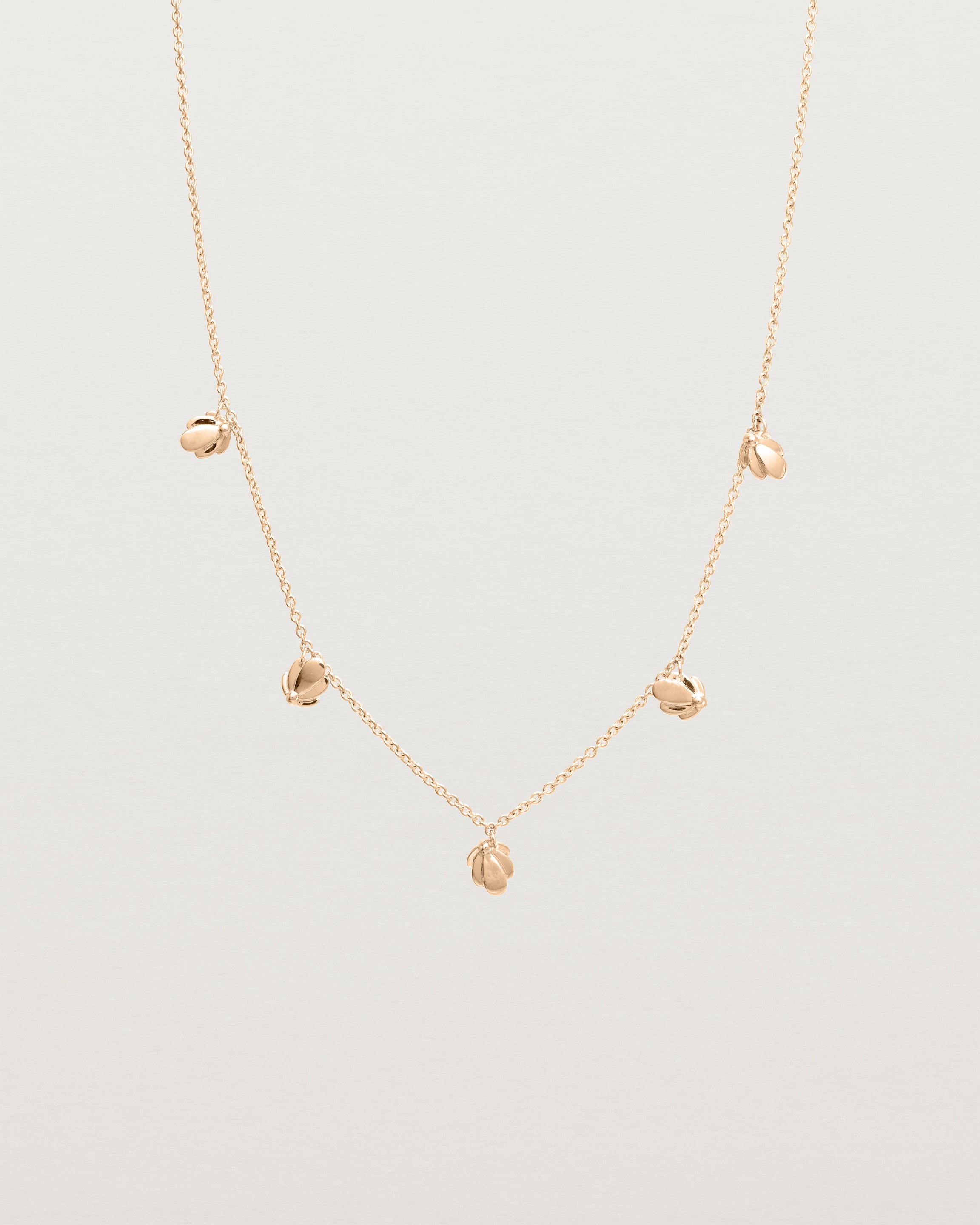 Front view of the Aeris Charm Necklace in Rose Gold.