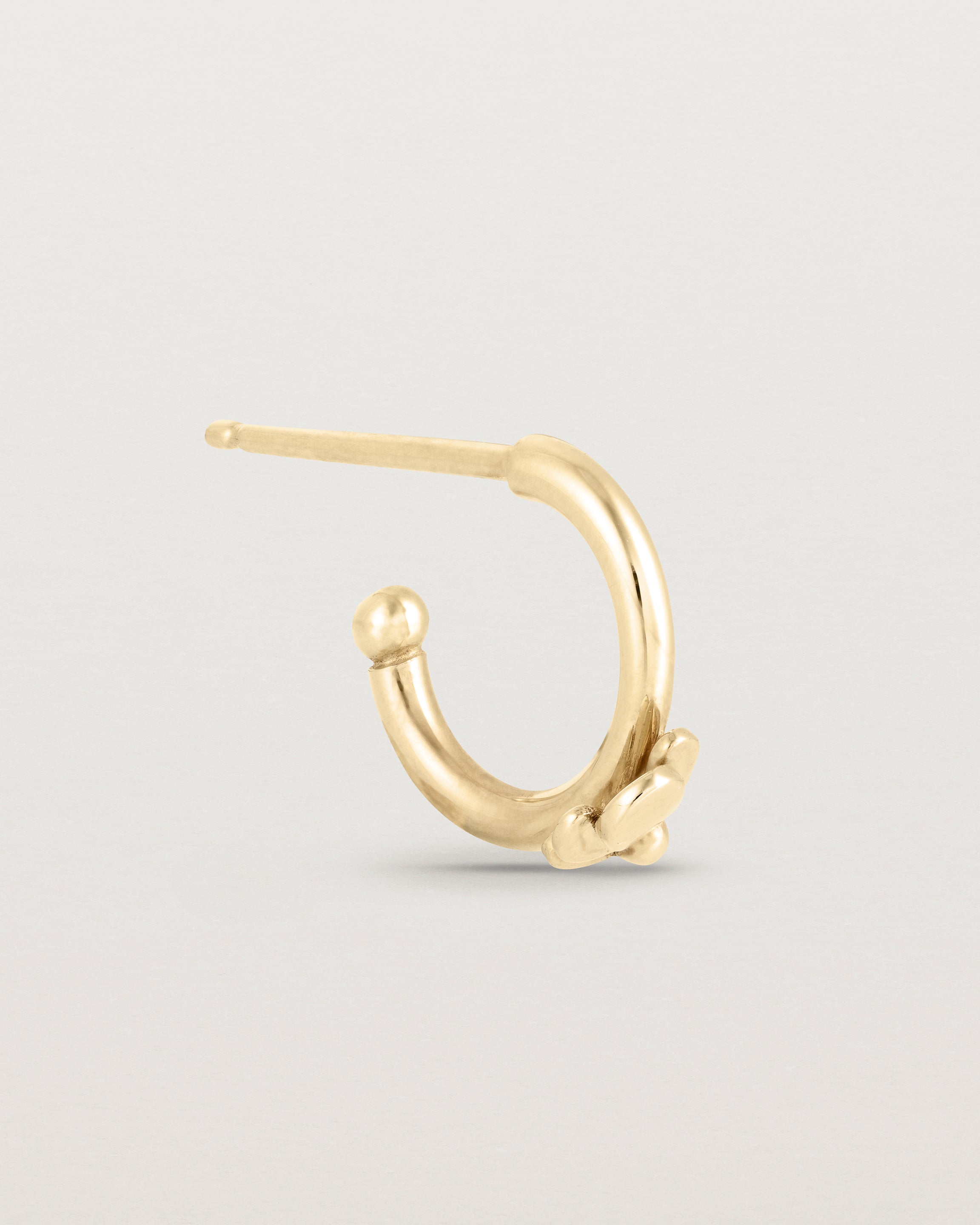 A single Aeris Hoop in yellow gold.