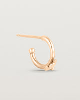 A single Aeris Hoops in Rose Gold.