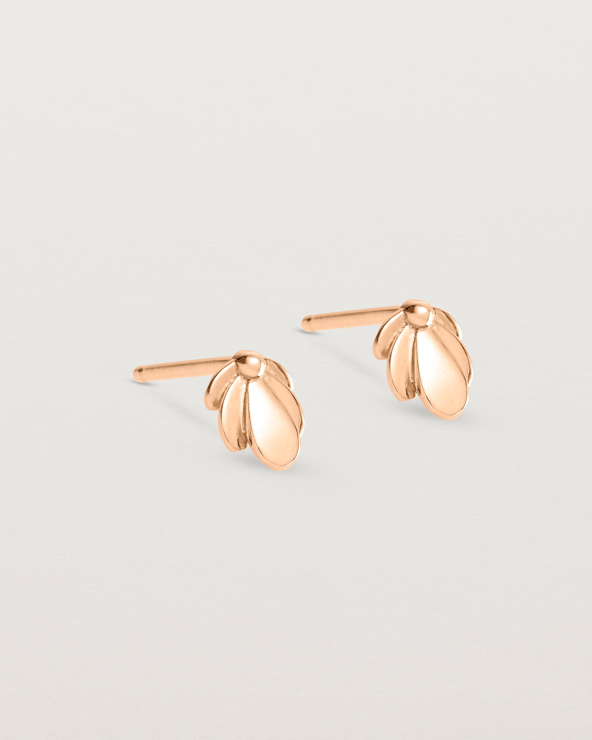 Angled view of the Aeris Studs in Rose Gold.