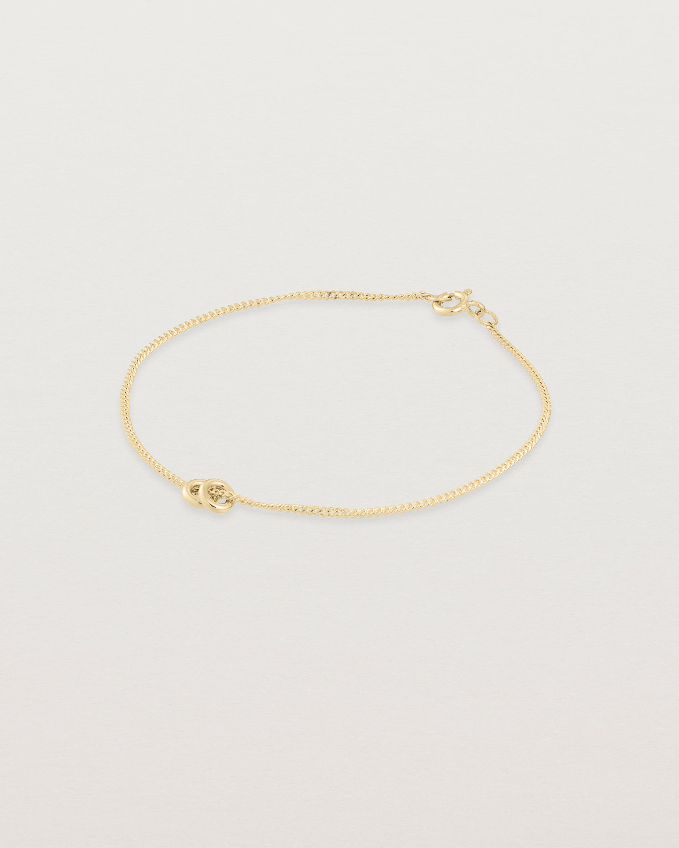 Aether bracelet featuring two round charms in yellow gold