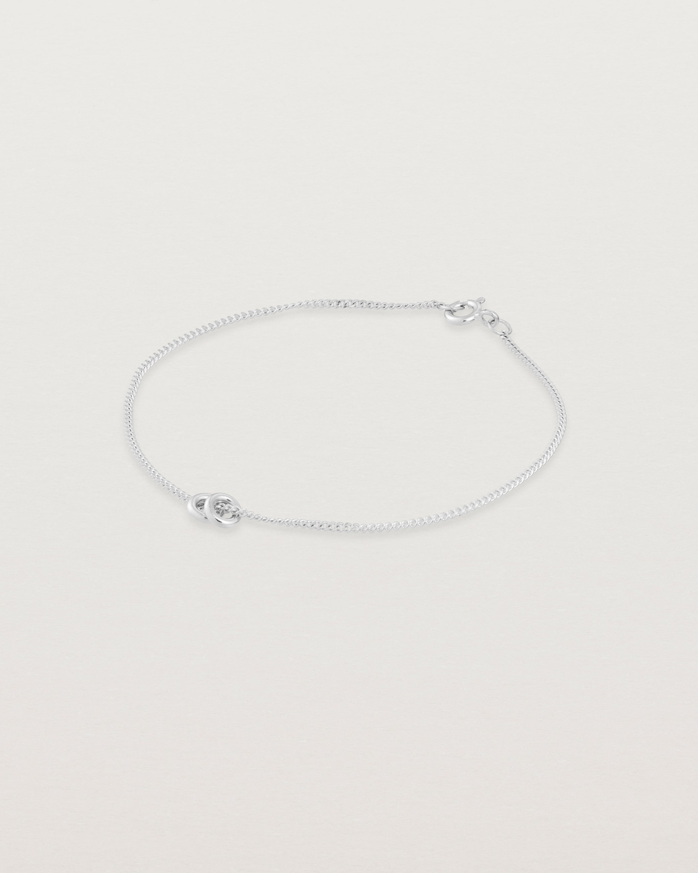 close up view of the Aether Bracelet showing two round charm in sterling silver