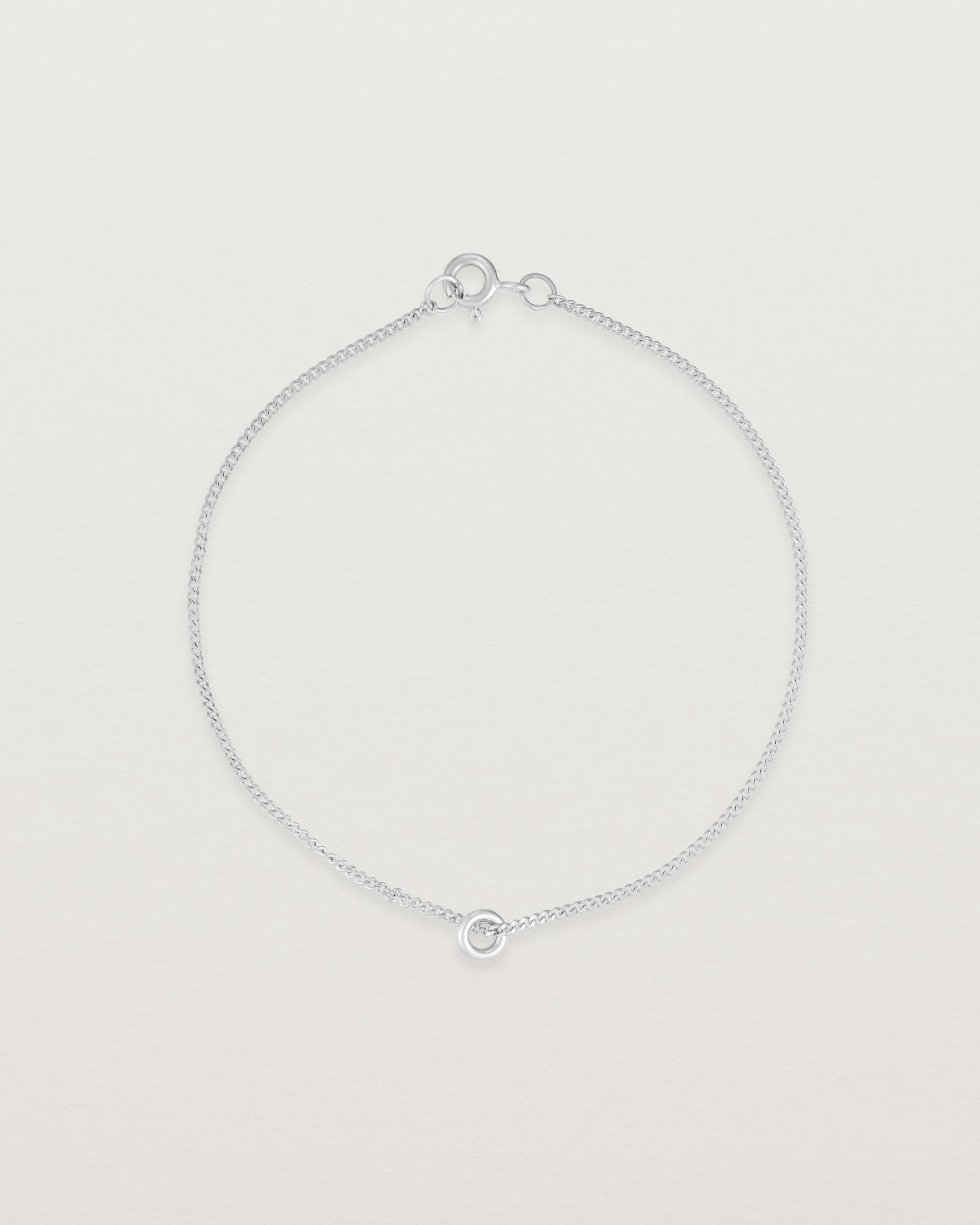 Top view of the Aether Bracelet showing one round charm in sterling silver