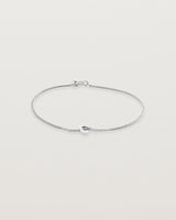 A fine sterling silver chain bracelet featuring a sterling silver circular charm