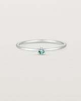 Front facing deep etched image of a white gold ring with an alexandrite birthstone.