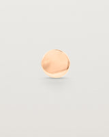 A round rose gold lapel pin