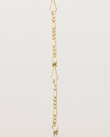 A close up of the Anam Charm Bracelet in yellow gold.