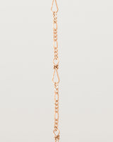 A close up of the Anam Charm Bracelet in rose gold.