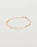The Anam Charm Bracelet in rose gold.