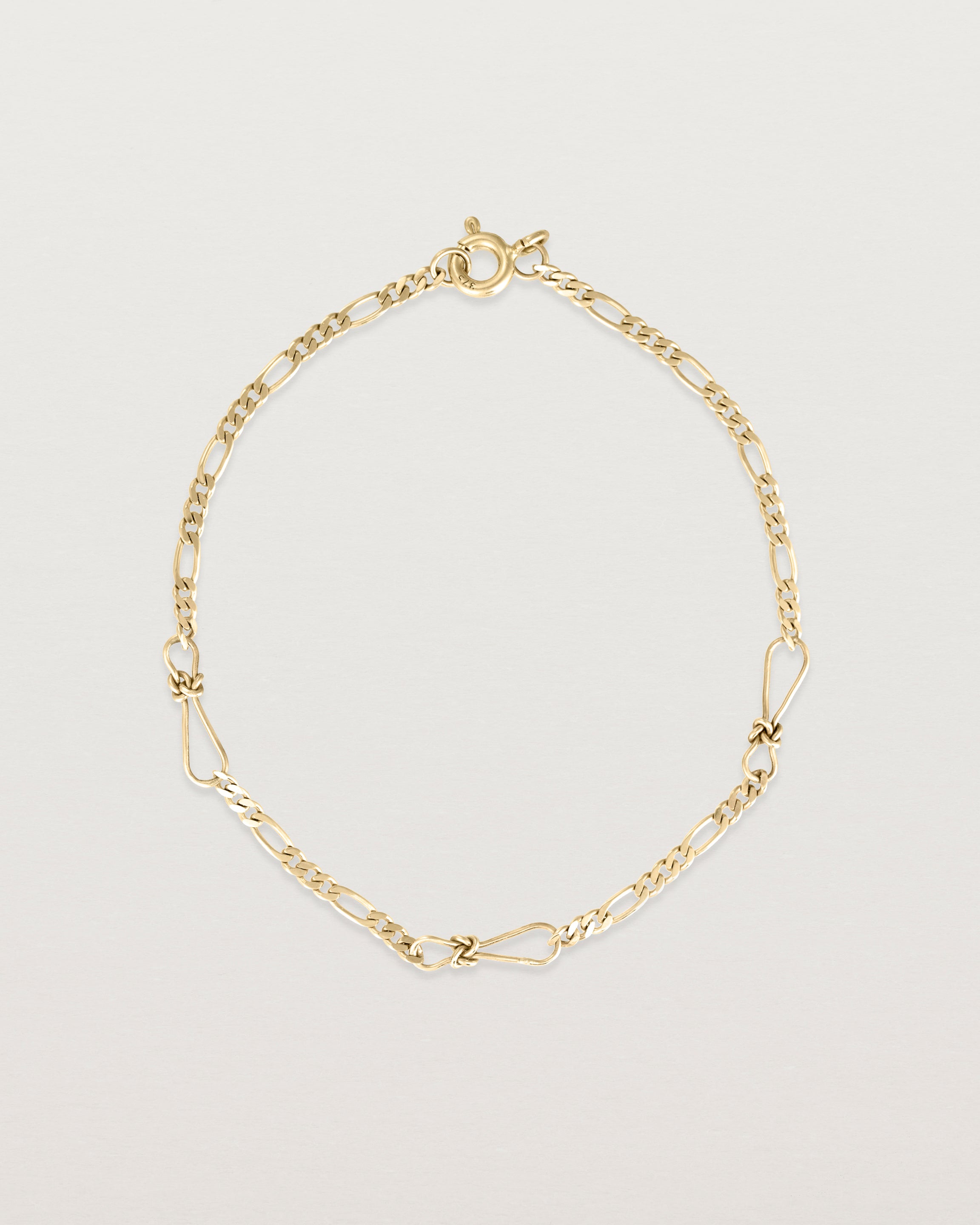 The Anam Charm Bracelet in yellow gold.
