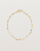 The Anam Charm Bracelet in yellow gold.