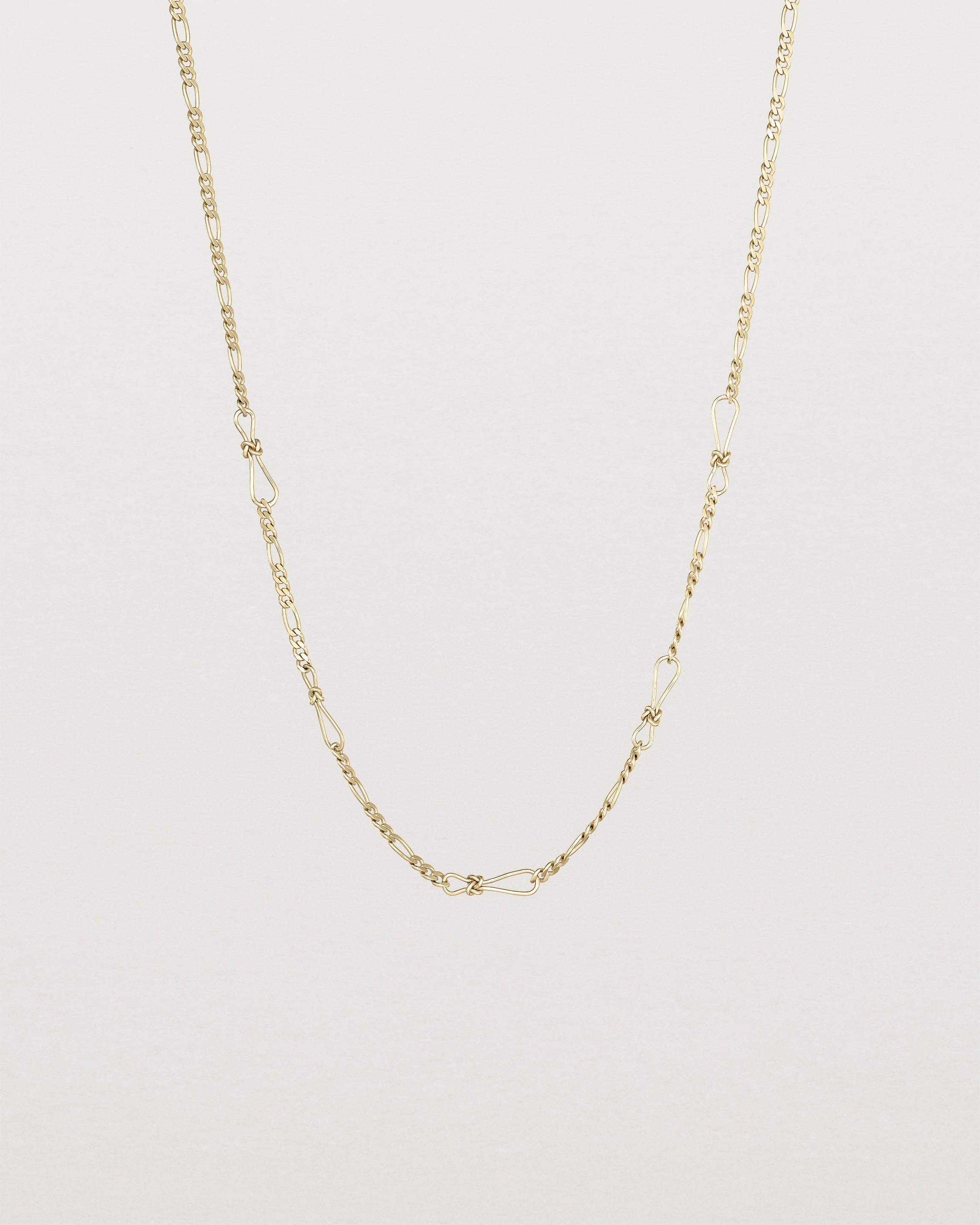 The Anam Charm Necklace in yellow gold.