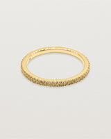 yellow gold band featuring micro pave champagne diamonds