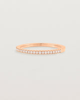 rose gold band with half a band of micro pave diamonds