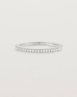 white gold band with half a band of micro pave diamonds