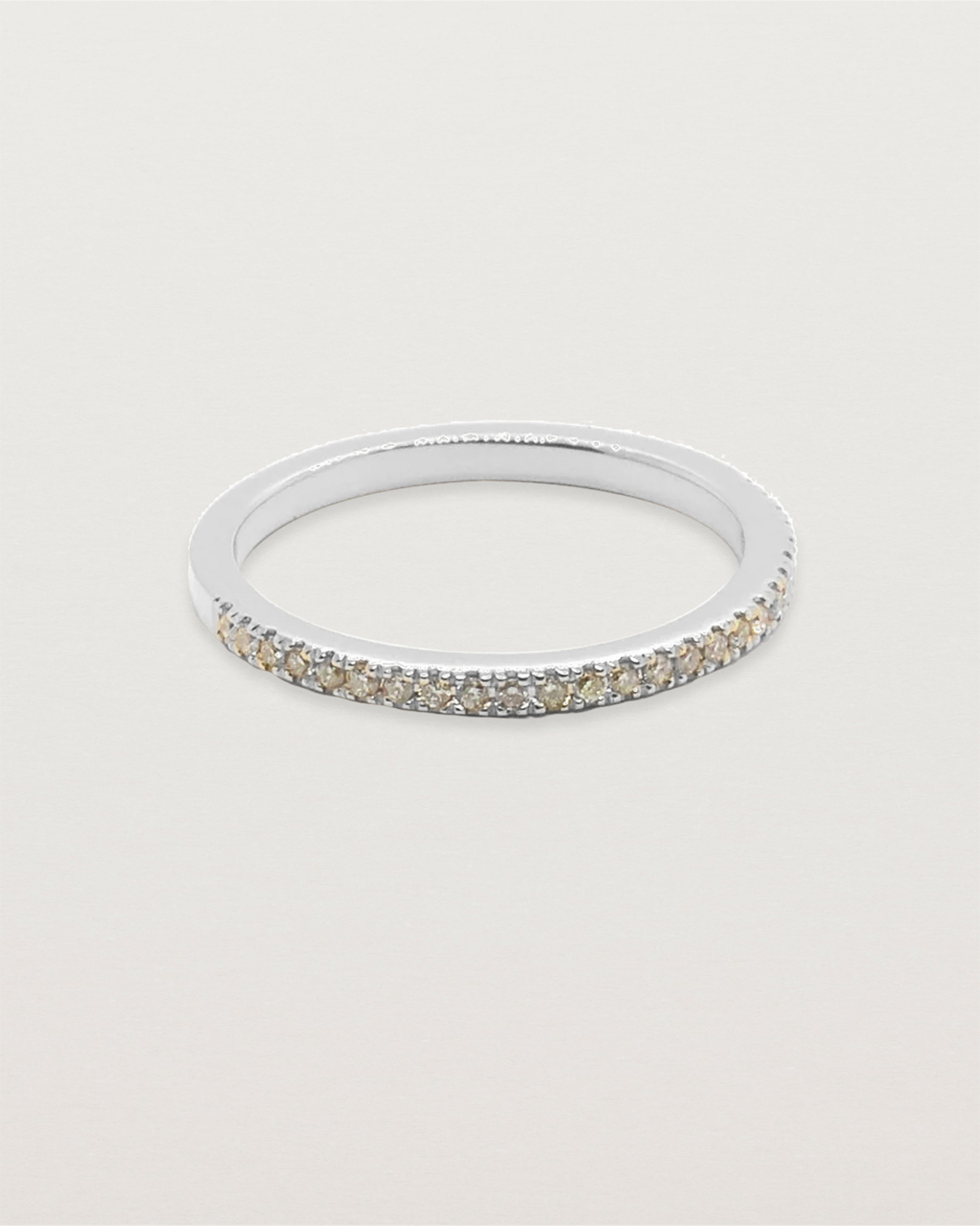 Front view of Annie band with champagne diamonds in white gold