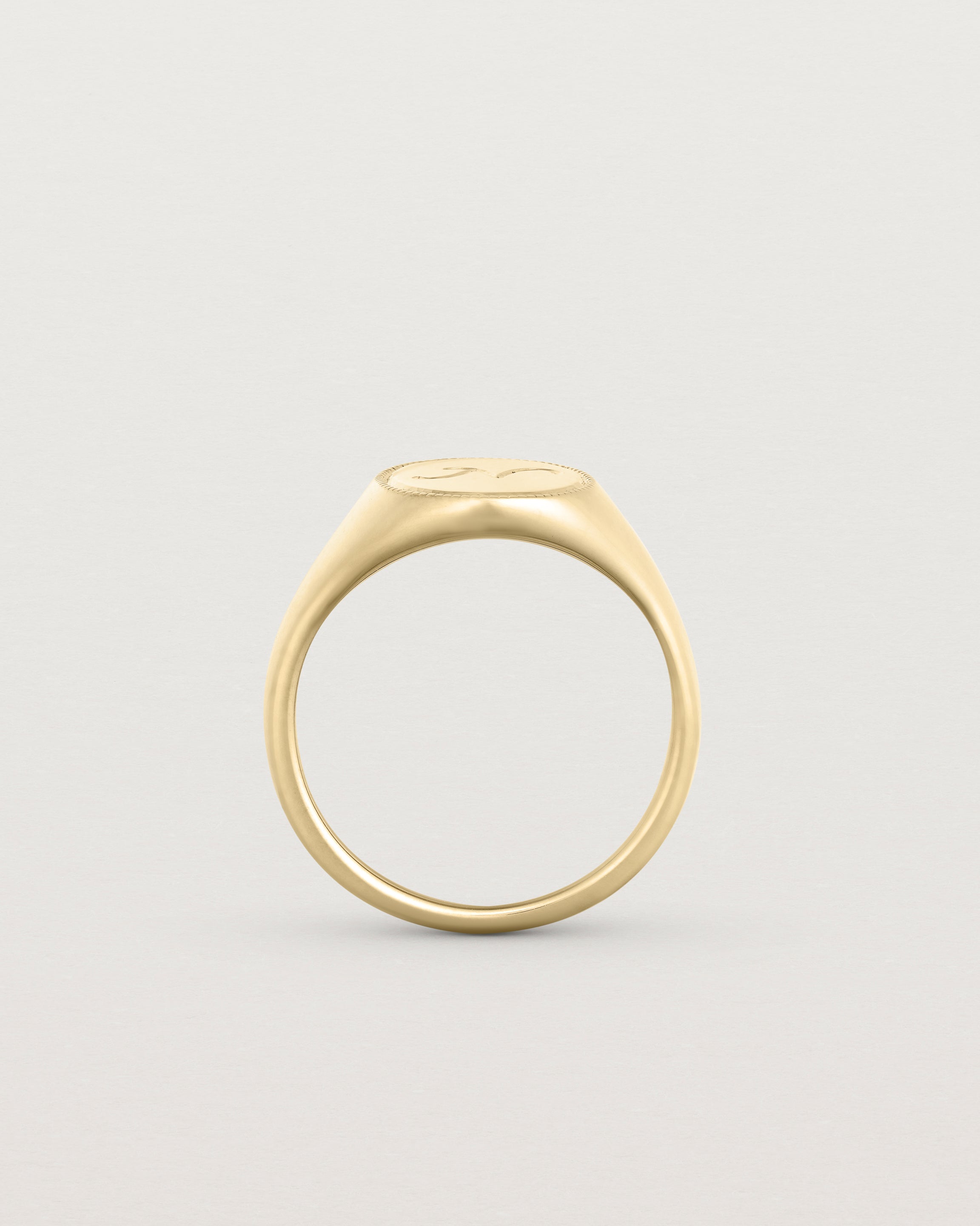 Standing view of the Arden Signet Ring | Millgrain in yellow gold.