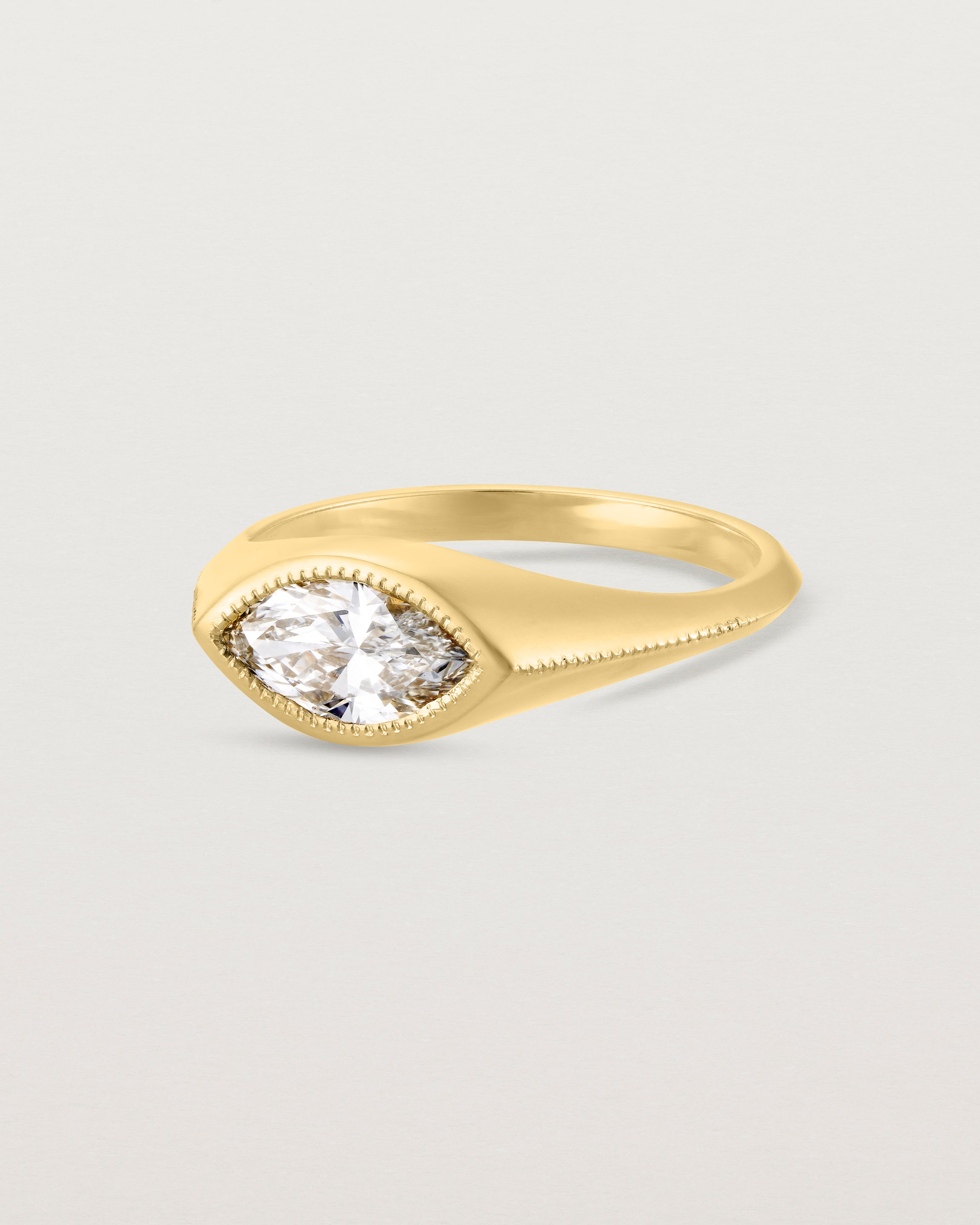 Angled view of the Átlas Marquise Signet | Laboratory Grown Diamond in yellow gold, in a polished finish.
