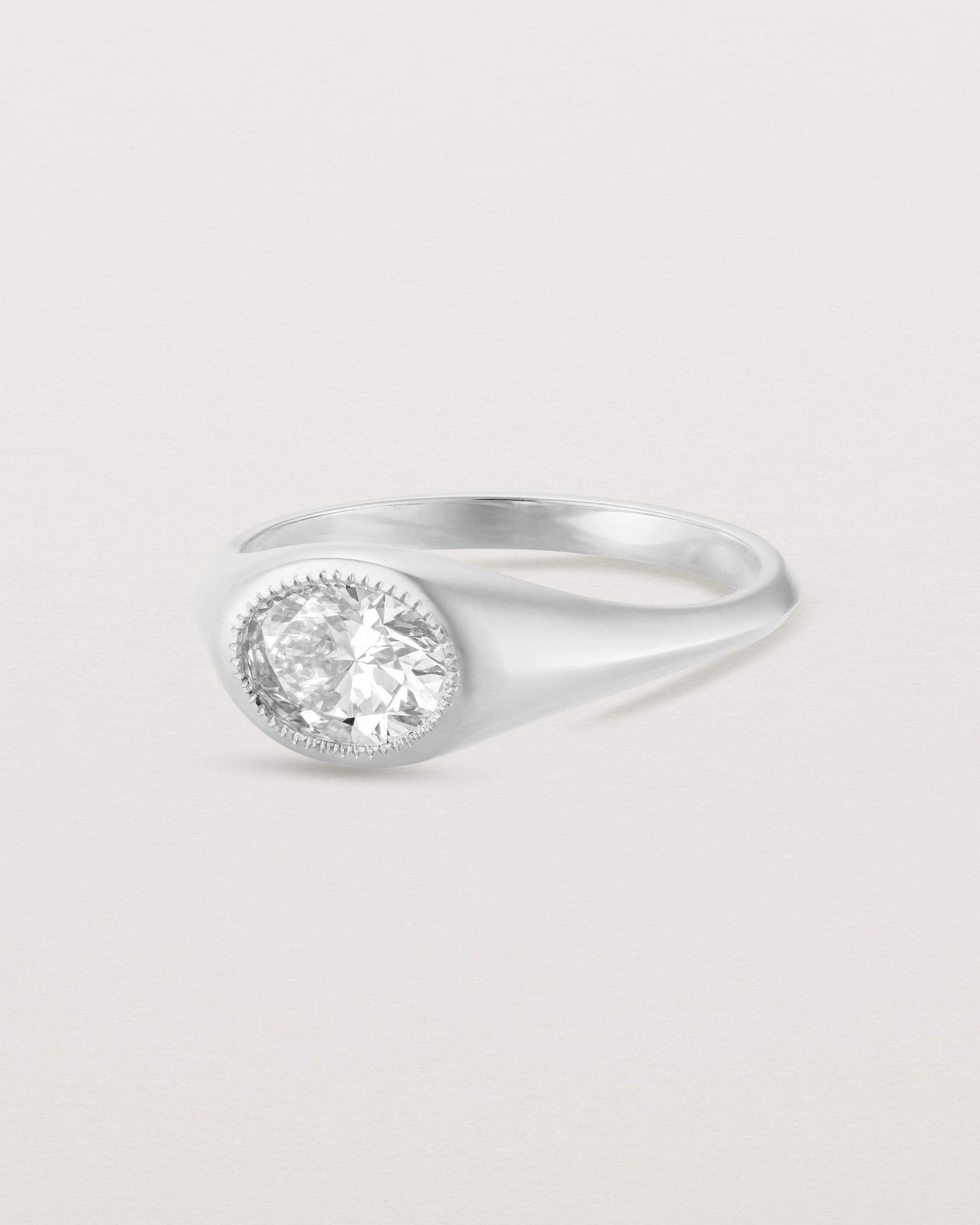 Angled view of the Átlas Oval Signet | Laboratory Grown Diamond in white gold, with a polished finish.