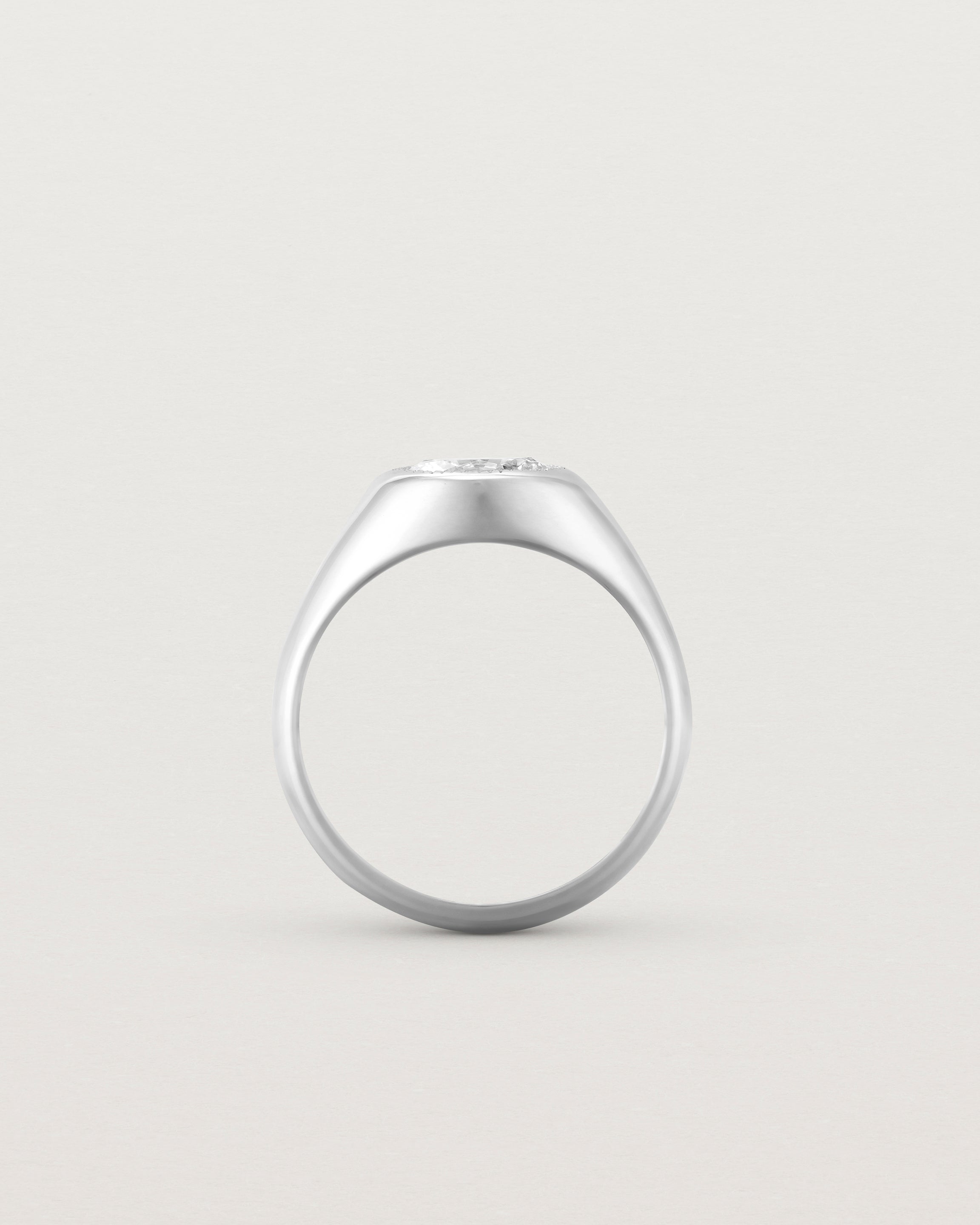 Standing view of the Átlas Oval Signet | Laboratory Grown Diamond in white gold, with a polished finish.