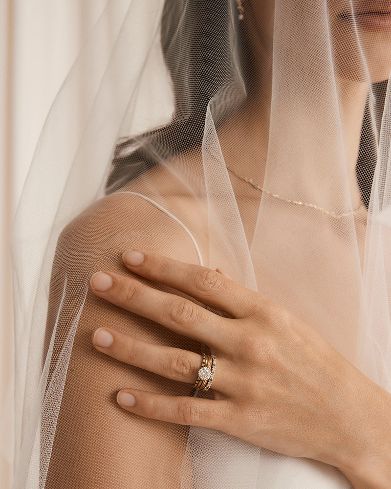 Image of model wearing aurelia ring with diamonds and sapphires