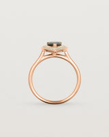 Standing view pear halo ring featuring a pear cut australian blue sapphire and a halo of white diamonds