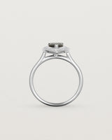 standing view pear halo ring featuring a pear cut australian blue sapphire and a halo of white diamonds in white gold